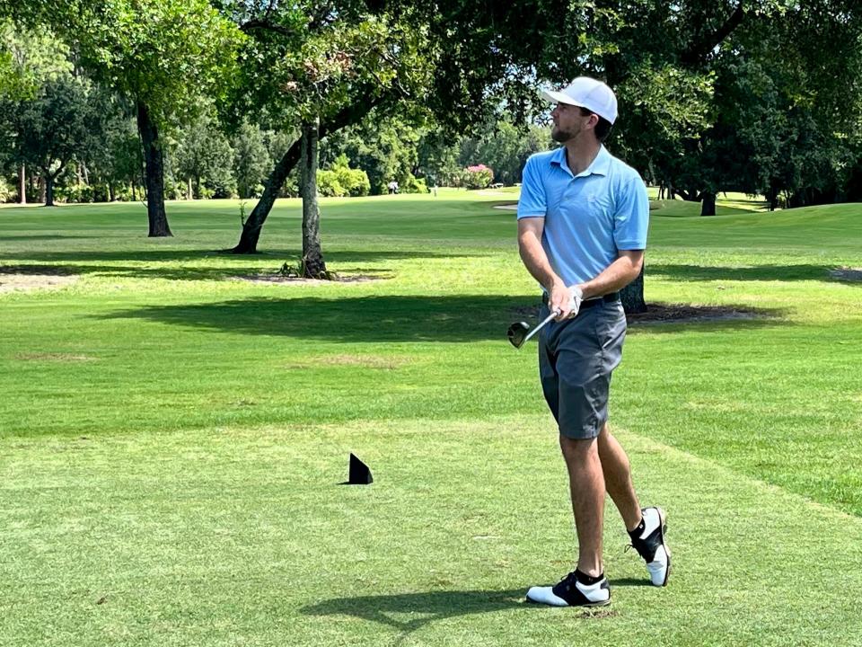 Davis Roche, the 2018 Jacksonville Amateur champion, follows the flight of his tee shot at the par-3 15th hole at the Deerwood Country Club on Thursday.