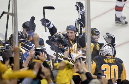 May 25, 2017; Pittsburgh, PA, USA; Pittsburgh Penguins celebrate after beating the Ottawa Senators in game seven of the Eastern Conference Final of the 2017 Stanley Cup Playoffs at PPG PAINTS Arena. Mandatory Credit: Don Wright-USA TODAY Sports