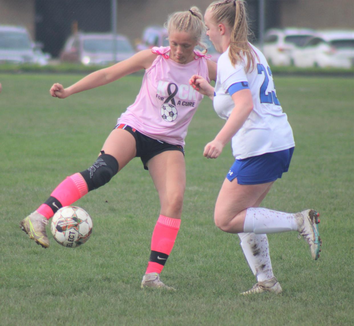 Cheboygan senior Taylor Bent (left) attempts to dribble past an Oscoda player during the first half on Wednesday.