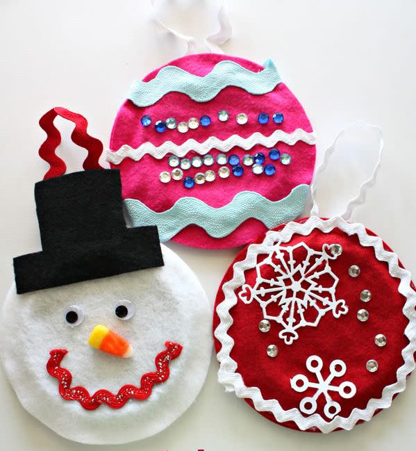<p>What gives these ornaments their perfectly round shape? They're re-used lids from Country Crock containers! They look festive and save an item from going in the recycling bin.</p><p><a href="https://www.nestofposies-blog.com/2012/12/crafting-with-kids-make-upcycled-christmas-ornaments/" rel="nofollow noopener" target="_blank" data-ylk="slk:Get the tutorial at Nest of Posies »;elm:context_link;itc:0;sec:content-canvas" class="link "><em>Get the tutorial at Nest of Posies »</em></a></p>