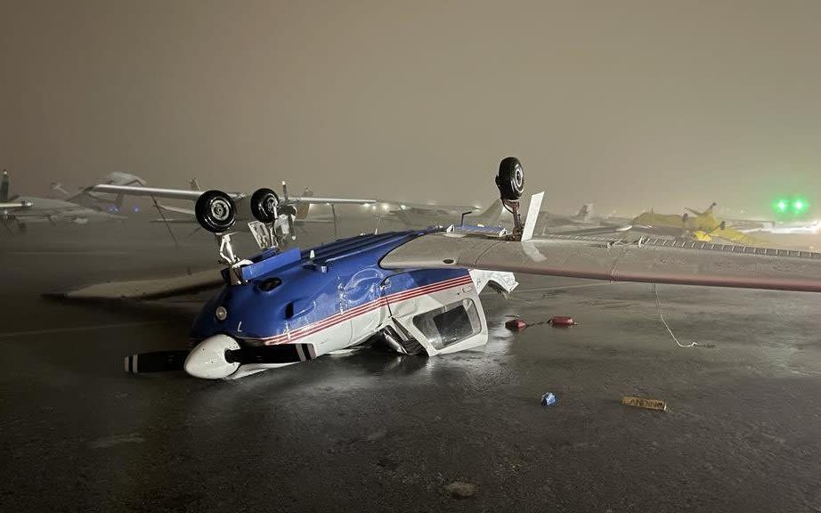 An plane flipped over on the runway at North Perry Airport in Pembroke Pines, Florida - NWSMIAMI/TWITTER