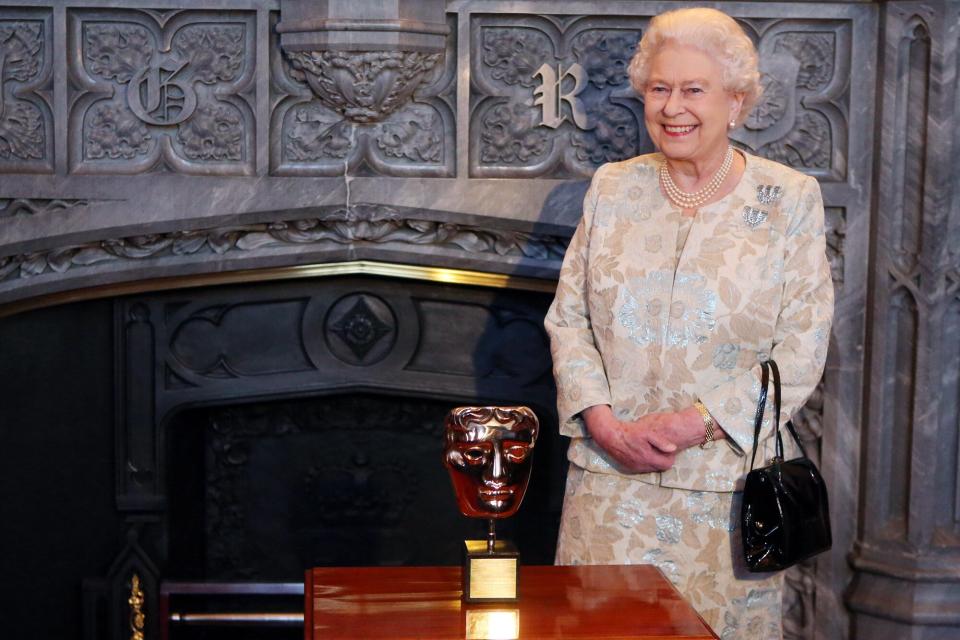 Queen Elizabeth II receives an honorary BAFTA in recognition of a lifetime's support to British Film and Television at Windsor Castle on April 4, 2013 in Berkshire, England.