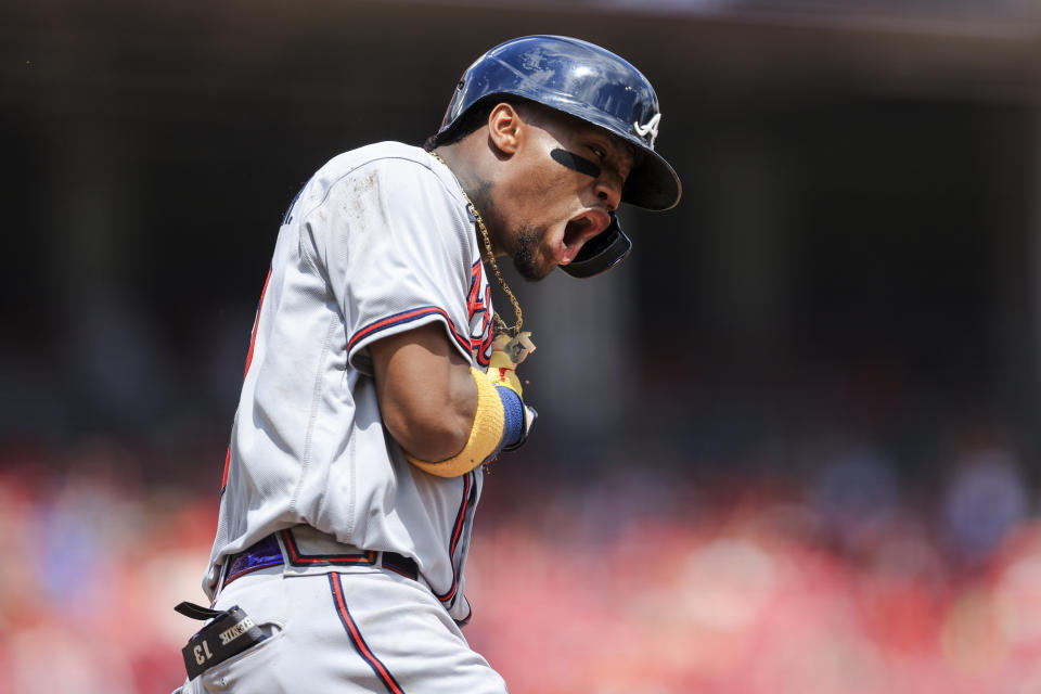 Atlanta Braves' Ronald Acuna Jr. reacts while running the bases after hitting a solo home run during the fifth inning of a baseball game against the Cincinnati Reds in Cincinnati, Sunday, June 27, 2021. (AP Photo/Aaron Doster)