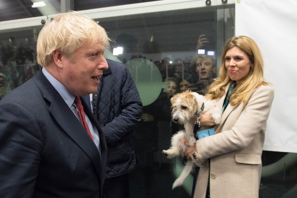 Prime Minister Boris Johnson with partner Carrie Symonds and dog Dilyn at the count for the Uxbridge & Ruislip South constituency in the 2019 General Election.