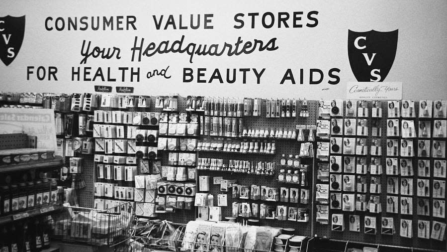 The first CVS logo — a shield containing the letters “CVS” — is displayed on the wall of a shop in the 1960s. (CVS Health)