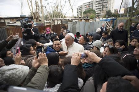 Pope Francis visits a shantytown on the outskirts of Rome February 8, 2015. REUTERS/Osservatore Romano