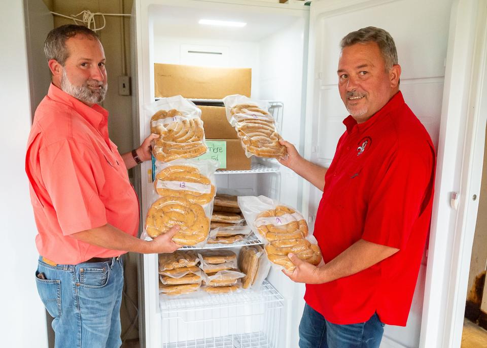 Delcambre Shrimp Festival.VP Jason Migues Pres Tracy Trim with new item at this years festival, shrimp boudin. Thursday, Aug. 4, 2022.