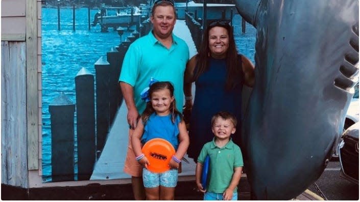 Matt and Lauren Kirchgessner of Louisville, Kentucky, stand with their two children, 4-year-old Baylor and 6-year-old Addie Kirchgessner. Both children were killed in a vehicle accident in Panama City Beach in December 2020.