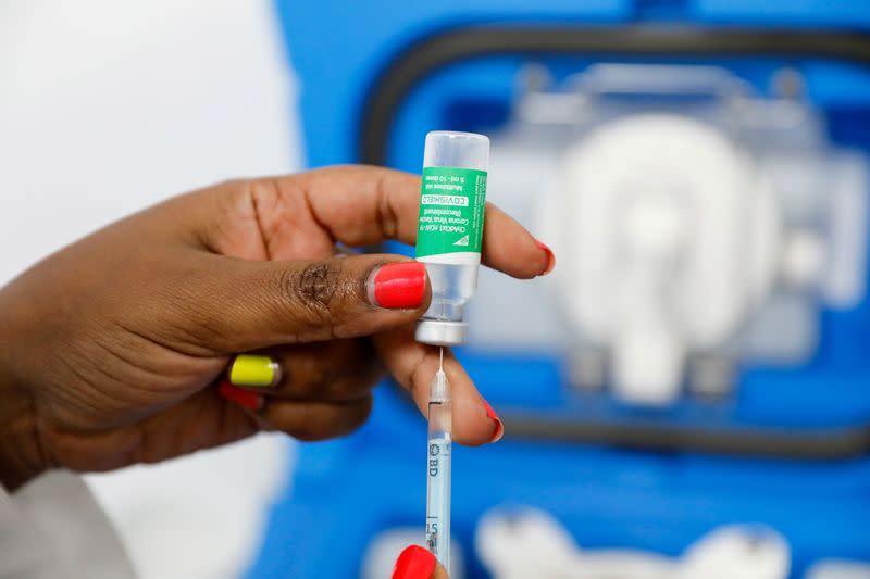 FILE PHOTO: A medical worker prepares a dose of AstraZeneca's COVID-19 vaccine, in Nairobi