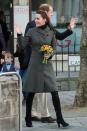<p>For a trip to North Wales with Prince William, the royal opts for a gray Reiss coat, jeans and knee-high suede boots. </p>