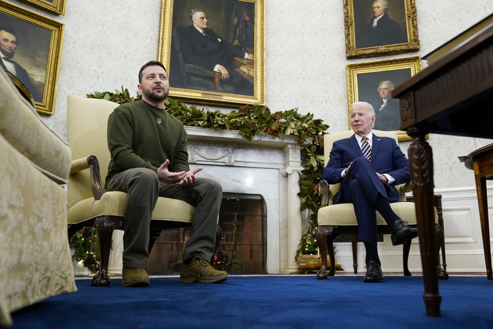 Ukrainian President Volodymyr Zelenskyy speaks as he meets with President Joe Biden in the Oval Office of the White House, Wednesday, Dec. 21, 2022, in Washington. (AP Photo/Patrick Semansky)