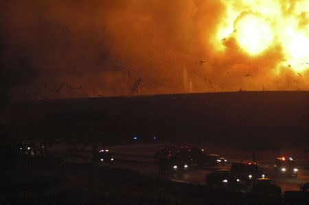 Cars drive on a highway as Takata's air bag plant is rocked by explosions in Monclova March 30, 2006. REUTERS/Gustavo Adolfo Rodriguez