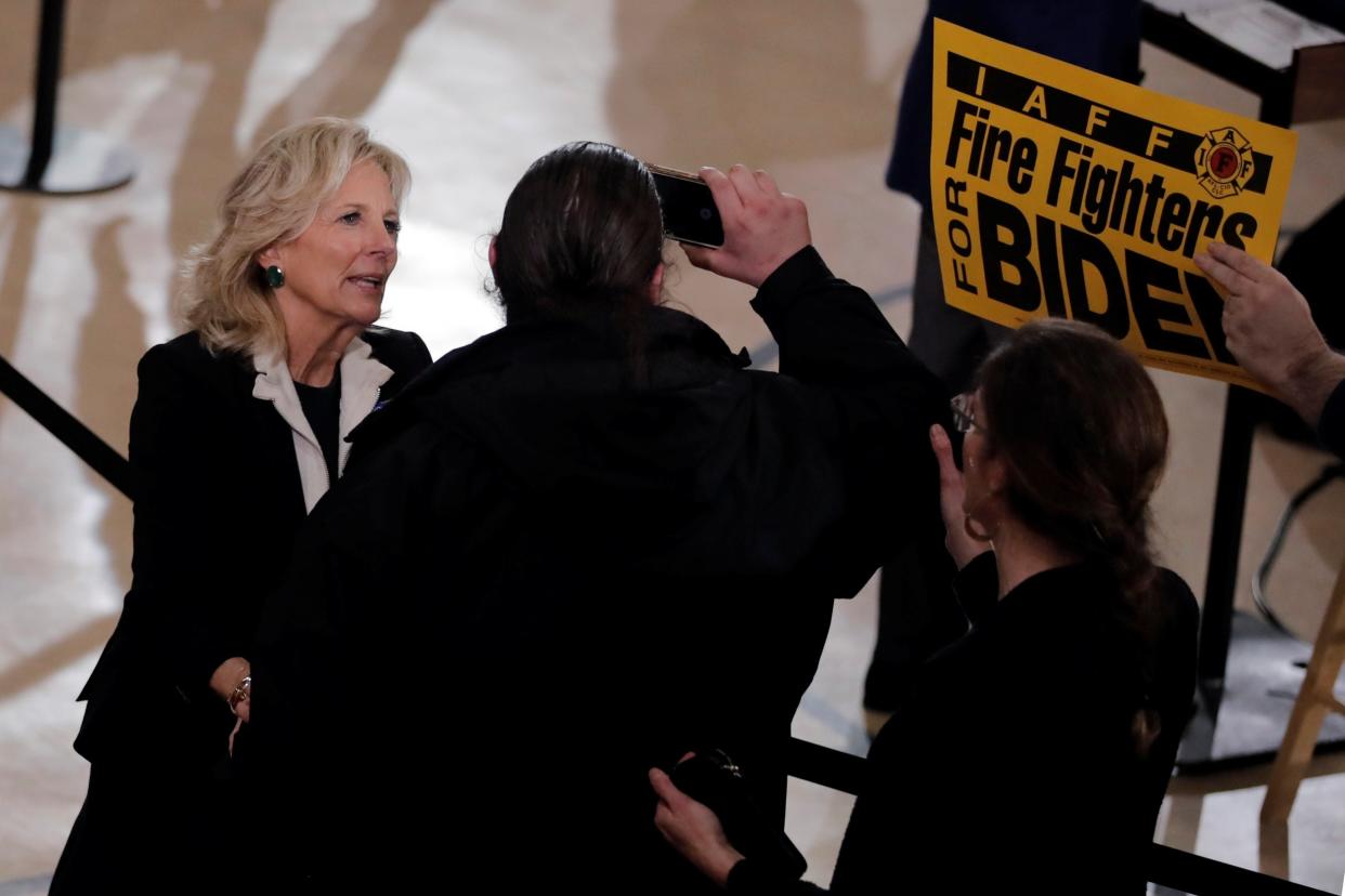 Jill Biden pushes away a protester who was trying to interrupt her husband Joe's speech at a campaign event in Manchester, New Hampshire: REUTERS