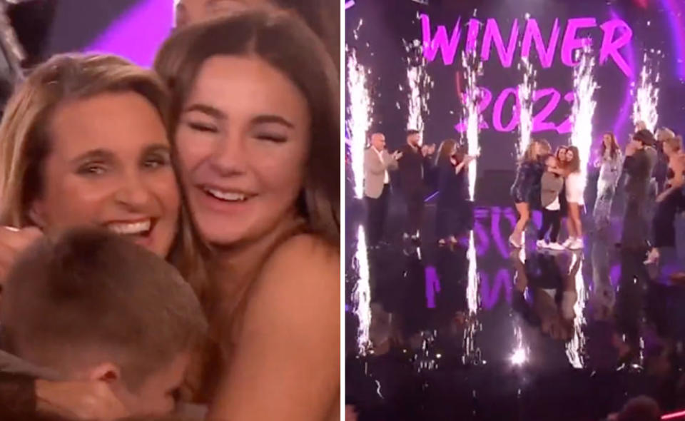 L: Reggie is hugged by her kids. R: A screen says WINNER 2022 in the background, Reggie and her kids are hugging and there are fireworks going off