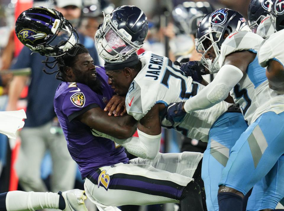 Aug 11, 2022; Baltimore, Maryland, USA;  Tennessee Titans safety Theo Jackson (29) tackles Baltimore Ravens quarterback Tyler Huntley (2) during the second quarter of a preseason game at M&T Bank Stadium. Mandatory Credit: Jessica Rapfogel-USA TODAY Sports