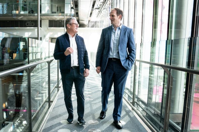 Labour Party leader Sir Keir Starmer welcomes MP and psychiatrist Dr Dan Poulter to the Labour Party at The Francis Crick Institute in London