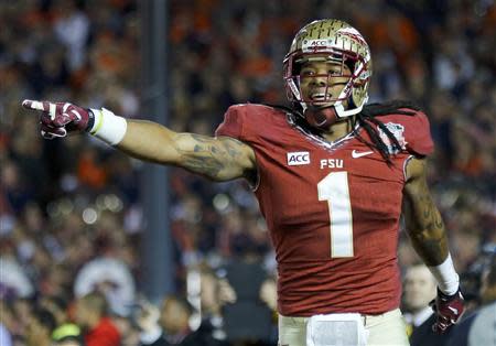 Florida State Seminoles Kelvin Benjamin celebrates after catching the game winning touchdown pass agasinst the Auburn Tigers in the fourth quarter during the BCS Championship football game in Pasadena, California January 6, 2014. REUTERS/Mike Blake