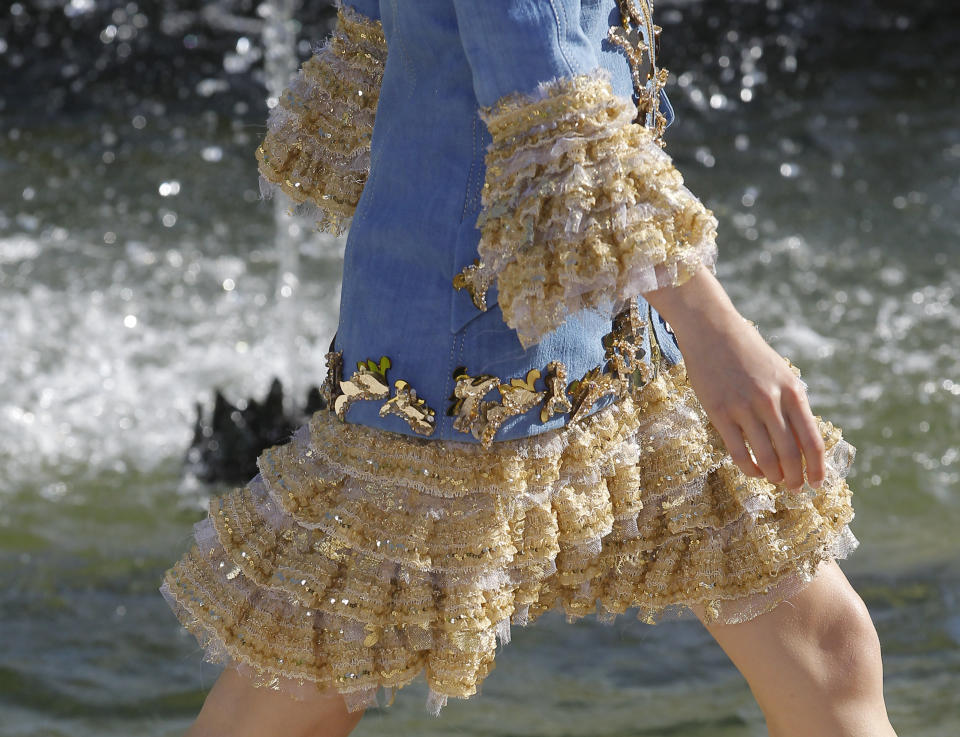 A model presents a creation by German fashion designer Karl lagerfeld for Chanel, Monday, May, 14, 2012. Master of Fashion, Karl Lagerfeld spares no expenses for his midseason Chanel Cruise show offering held at the former home of Marie Antoinette, the Chateau de Versailles, southwest of Paris. (AP Photo/Jacques Brinon)