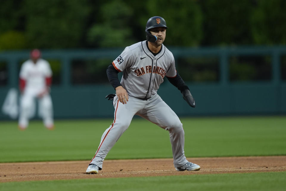 San Francisco Giants' Michael Conforto leads off second base after hitting an RBI double off of Philadelphia Phillies pitcher Taijuan Walker during the first inning of a baseball game, Sunday, May 5, 2024, in Philadelphia. (AP Photo/Matt Rourke)