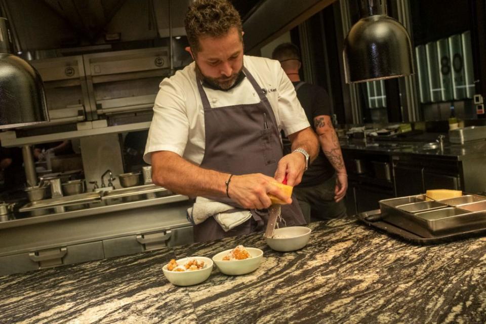 a chef preparing food in a kitchen