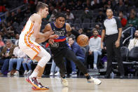 Detroit Pistons guard Jaden Ivey, right, drives against Atlanta Hawks guard Bogdan Bogdanovic, left, during the second half of an NBA basketball game Tuesday, March 21, 2023, in Atlanta. (AP Photo/Alex Slitz)