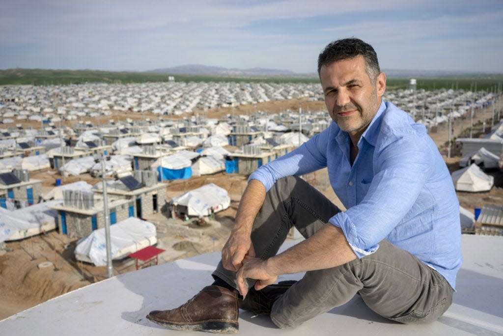 The Kite Runneru0022 author Khaled Hosseini overlooking a refugee camp. Photo by United Nations High Commission For Refugees Brian Sokol