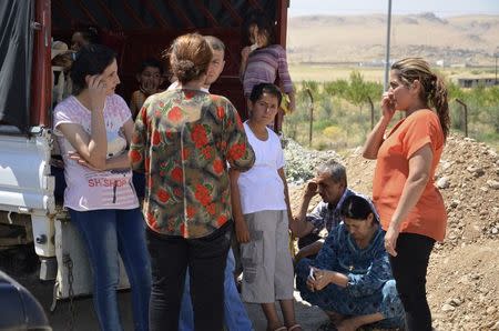 Displaced people, who fled from the violence in the province of Nineveh, arrive at Sulaimaniya province August 8, 2014. REUTERS/Stringer