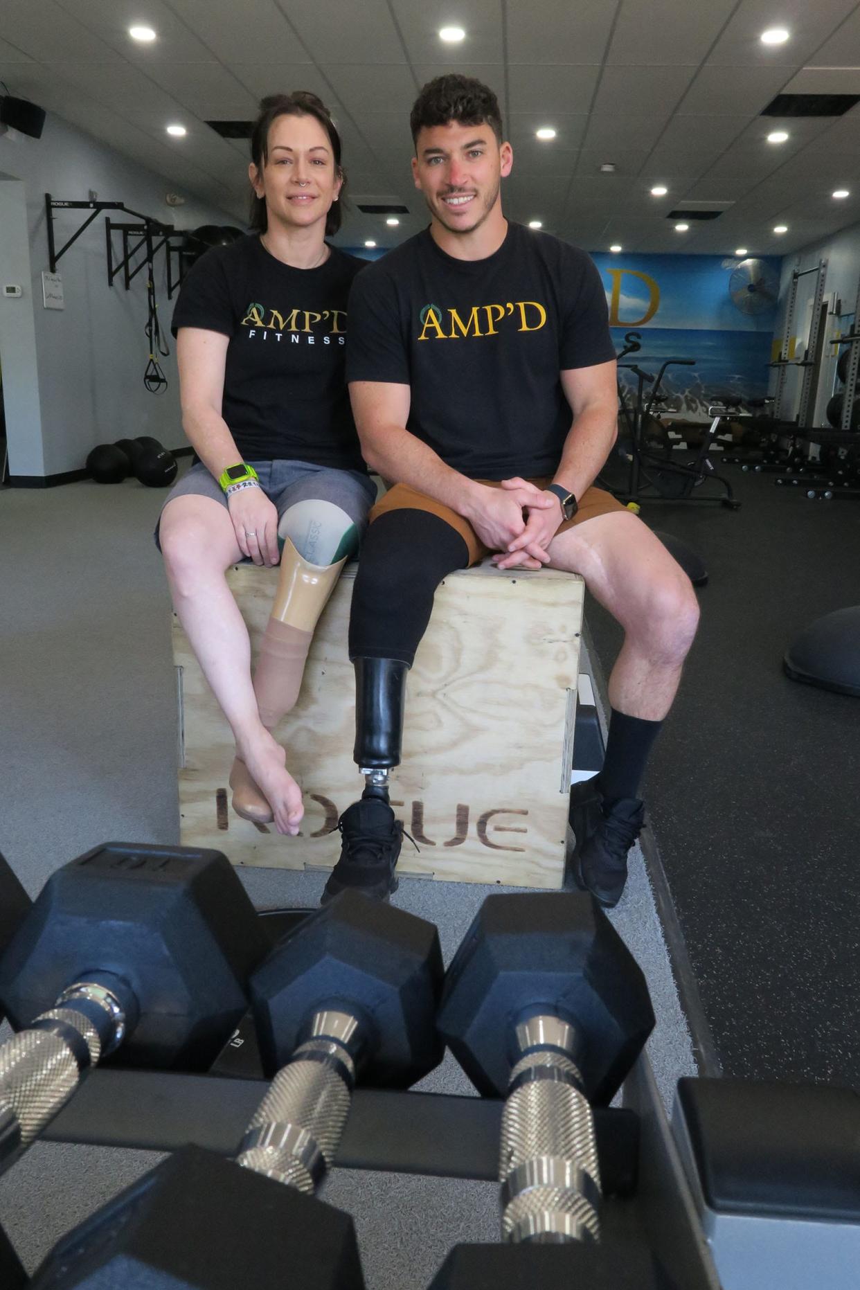 AmyMarie DeLuca is shown with AMP'D Fitness owner Max Gomez in Belmar Tuesday, March 19, 2024. She needs a new prosthetic leg and can't afford it through insurance. Members of the gym have banded together to raise money for it.