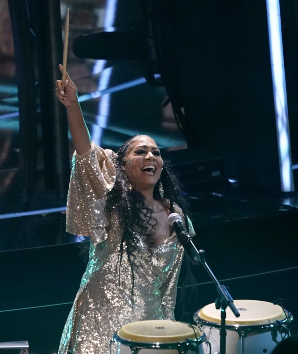 Sheila E. plays the drums.