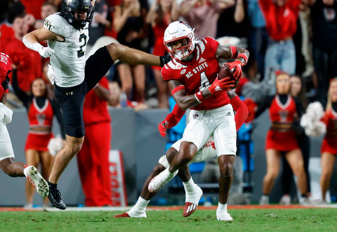 N.C. State safety Cyrus Fagan (4) looks downfield after intercepting the ball intended for Wake Forest wide receiver Taylor Morin (2) during the second half of N.C. State’s 30-21 victory over Wake Forest at Carter-Finley Stadium in Raleigh, N.C., Saturday, Nov. 5, 2022.