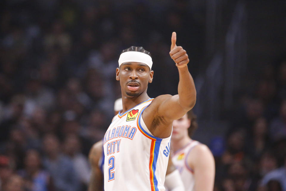 Oklahoma City Thunder guard Shai Gilgeous-Alexander (2) gives a thumbs up during the first half of an NBA basketball game against the Los Angeles Clippers Tuesday, March 21, 2023, in Los Angeles. (AP Photo/Ringo H.W. Chiu)