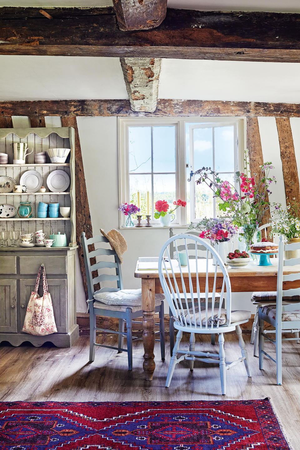 <p> 'Where once kitchens were purely practical and designed to be functional, now we are looking to create lived-in looks for them that are more a reflection of the decor in the rest of our homes, particularly our living spaces,' says <em>Homes & Gardens</em> Editor in Chief Lucy Searle. </p> <p> 'The easiest way to transform an existing kitchen is with textiles – rugs or runners that can withstand or disguise the odd splash or stain along a run of cabinetry or under a dining table, and pretty cushion pads on seats are a good place to start. Another way to introduce color and texture is by showing off decorative china and pottery on open shelving.' </p>