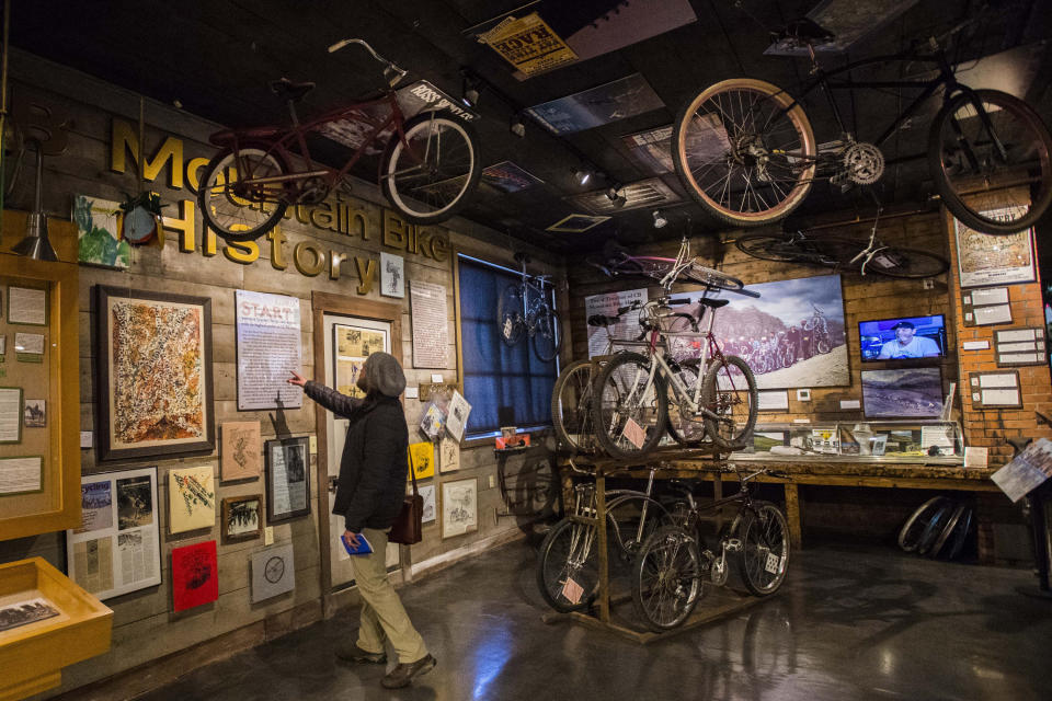 In this Dec. 4, 2018 photo, a man looks at a display in the Mountain Heritage Museum on Elk Avenue in Crested Butte, in Gunnison, County, Colo. When the small county in the Colorado mountains banished everyone but locals to blunt the spread of coronavirus, an unlikely outsider raised a fuss: Texas Attorney General Ken Paxton, who called it an affront on Texans who own property there and pressed health officials to soften the rules. (Christian Murdock/The Gazette via AP)