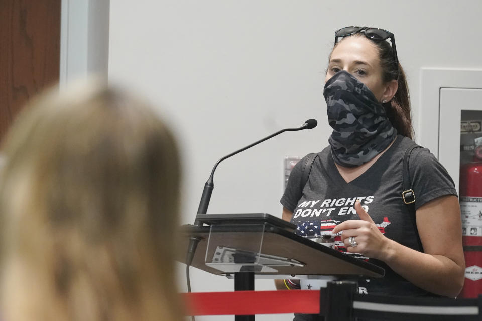 Jenna Hague speaks at the Broward School Board's emergency meeting, Wednesday, July 28, 2021, in Fort Lauderdale, Fla. The board listened to parents' concerns and will make a decision regarding the use of masks for K-12 students in the upcoming school year. (AP Photo/Marta Lavandier)