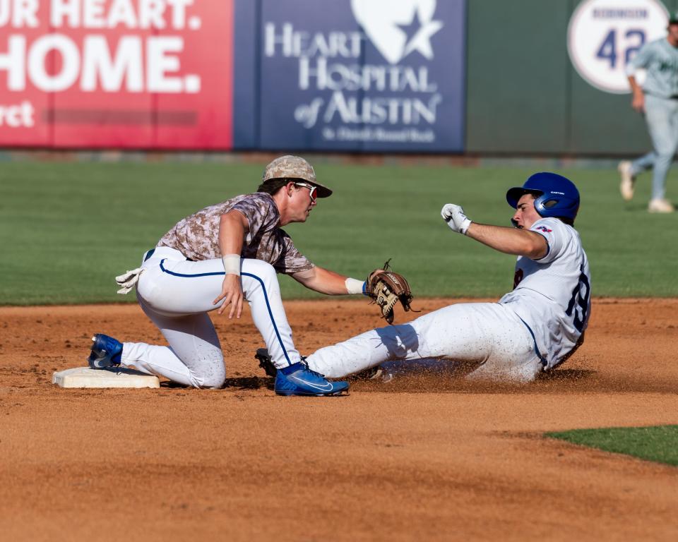 Westlake's Cole May, playing for the South team, beats the throw to EJ Davis of Georgetown during the Austin Area Baseball Coaches Association All-Star game, which was played at Dell Diamond in Round Rock on Sunday. The North and South teams played to a 7-7 tie.