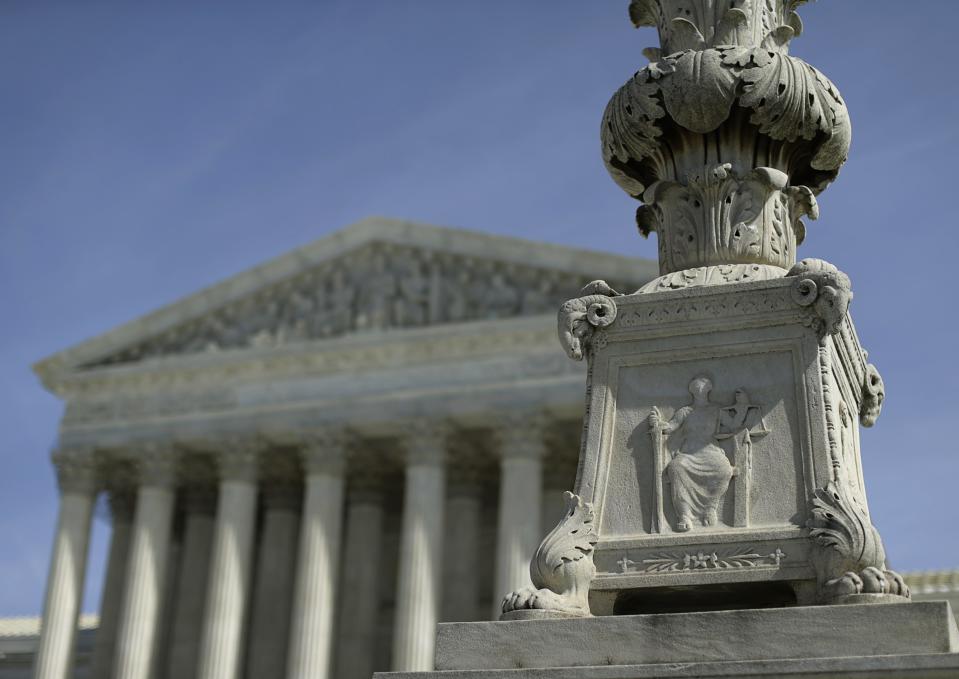 The exterior of the U.S. Supreme Court is seen in Washington March 5, 2014. U.S. Supreme Court justices on Wednesday appeared to look for a compromise that would enable them to avoid overruling a 26-year-old precedent that made it easier for plaintiffs to negotiate large class action settlements. REUTERS/Gary Cameron (UNITED STATES - Tags: BUSINESS POLITICS)