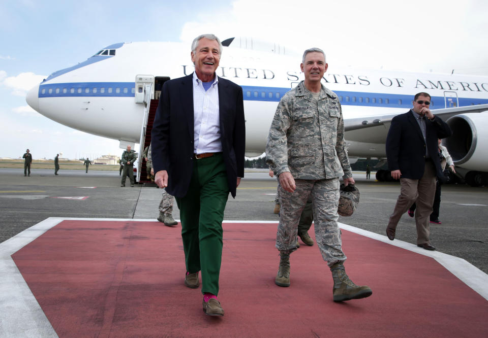 U.S. Secretary of Defense Chuck Hagel, walks with Commander of U.S. Force Japan Lt. Gen. Salvatore "Sam" Angelella upon his arrival on Saturday, April 5, 2014 at Yokota Air Force Base in Fussa, Japan. Hagel is on an Asian trip, the fourth since he took office, to Japan, China and Mongolia. (AP Photo/Alex Wong, Pool)