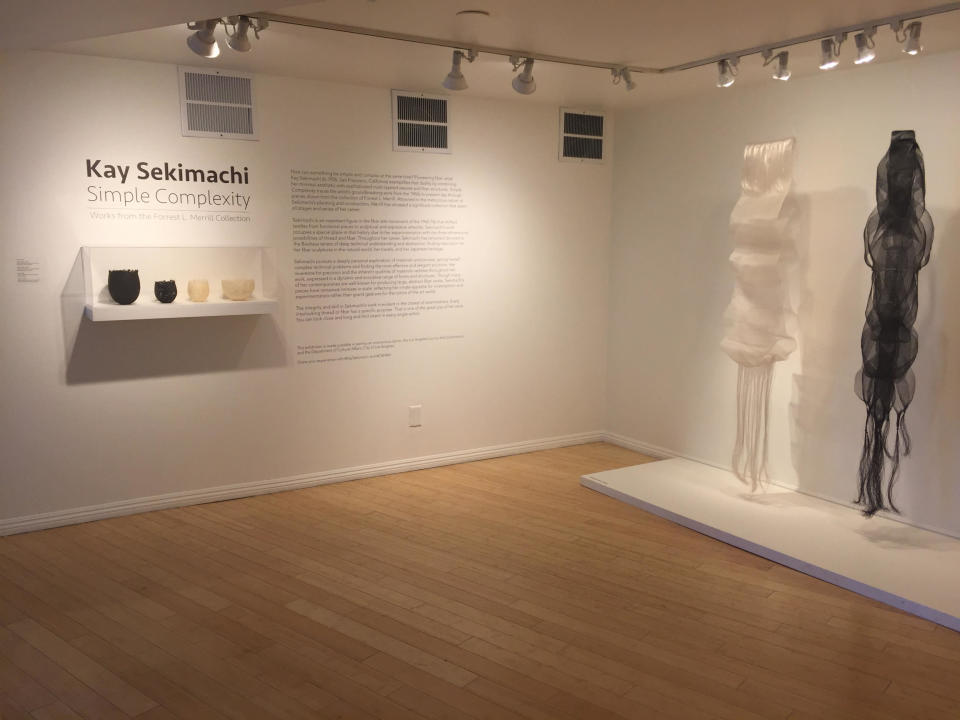 This photo taken on Dec. 2, 2016 at the Craft and Folk Art Museum in Los Angeles shows the entrance to the "Kay Sekimachi: Simple Complexity" exhibit there, chronicling the decades-long career of Berkeley, Calif., based 90-year-old fiber artist and weaver Kay Sekimachi. The exhibit opened on Sept. 25, 2016, and runs through Jan. 8, 2017. (Solvej Schou via AP)