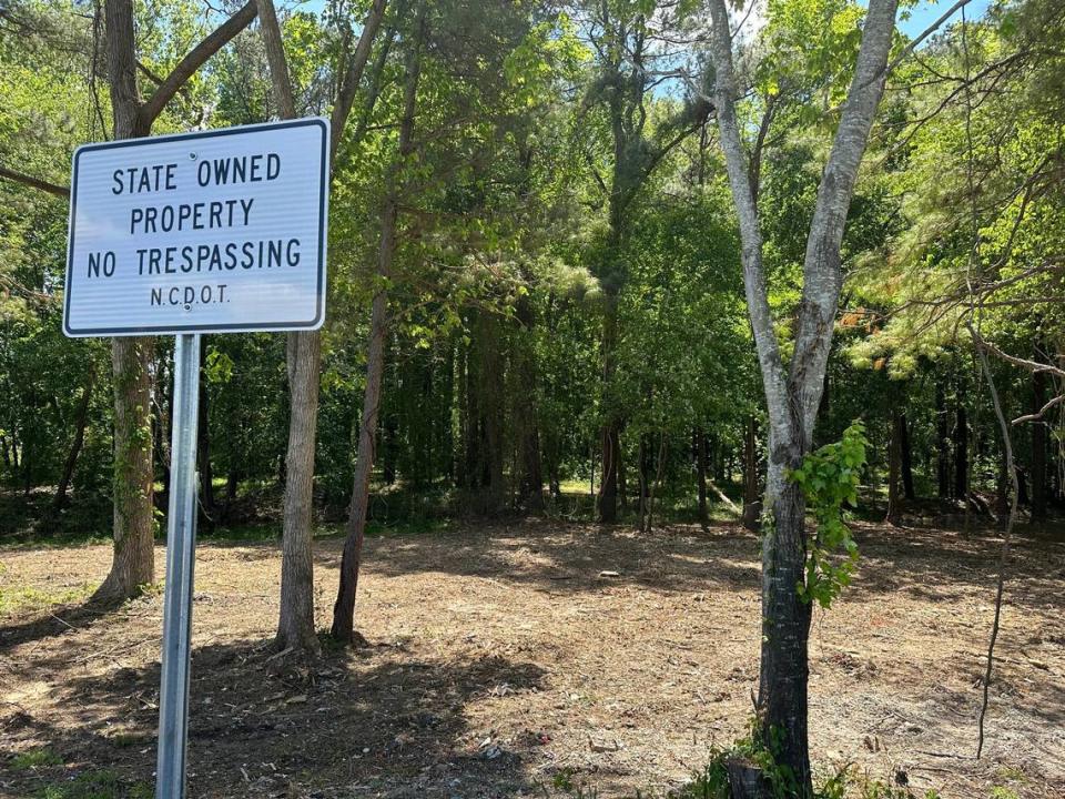 The N.C. Department of Transportation hopes clearing brush and posting “No Trespassing” signs will discouraging people from moving back to the South Saunders Street interchange with I-40.