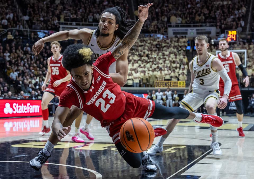 Wisconsin guard Chucky Hepburn loses the ball as he drives to the basket against Purdue forward Trey Kaufman-Renn during the first half Sunday at Mackey Arena.