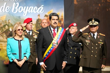 Venezuela's President Nicolas Maduro, his wife Cilia Flores and Defense Minister Vladimir Padrino arrives at the ceremony to commemorate the Bicentennial of the Boyaca Battle at the National Pantheon in Caracas