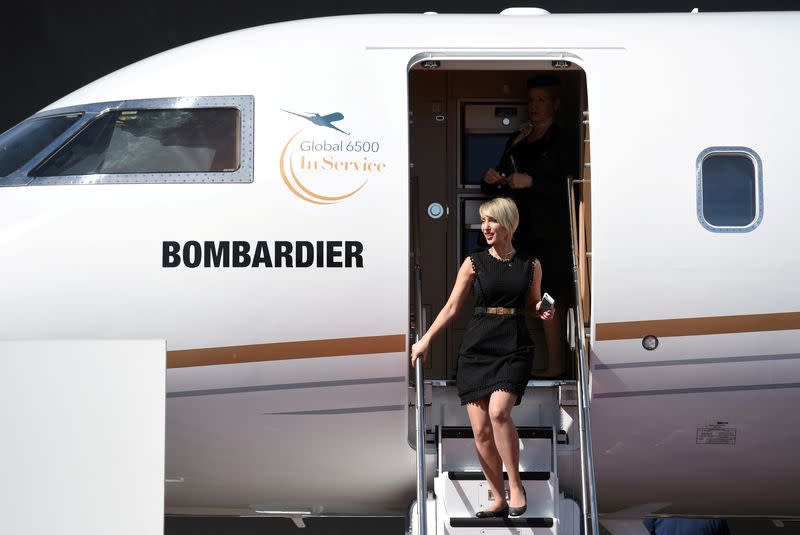 FILE PHOTO: An attendee exits the Bombardier Global 6500 business jet at the National Business Aviation Association (NBAA) exhibition in Las Vegas