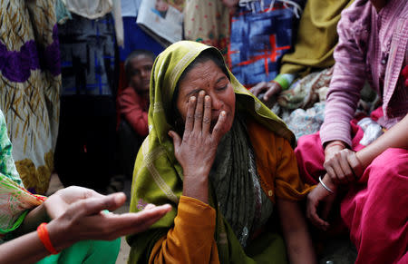 A relative of Yogesh Raj, a Hindu activist, cries after Raj got arrested for leading the protests in which two people died on Monday, in Nayabans village in Bulandshahr district, Uttar Pradesh, India December 5, 2018. REUTERS/Adnan Abidi