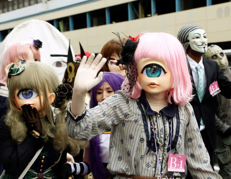 Participants in costumes march during a Halloween parade in Kawasaki