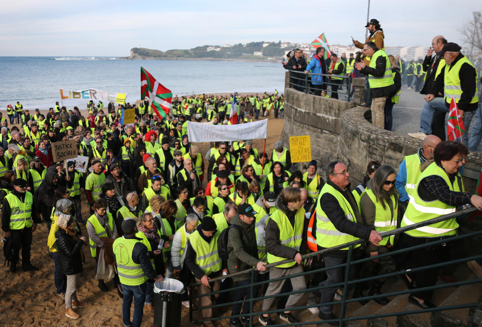 Yellow vest protesters demonstrate in Saint Jean De Luz, France, Saturday, Jan. 19, 2019. Yellow vest protesters are planning rallies in several French cities despite a national debate launched this week by President Emmanuel Macron aimed at assuaging their anger.(AP Photo/Bob Edme)