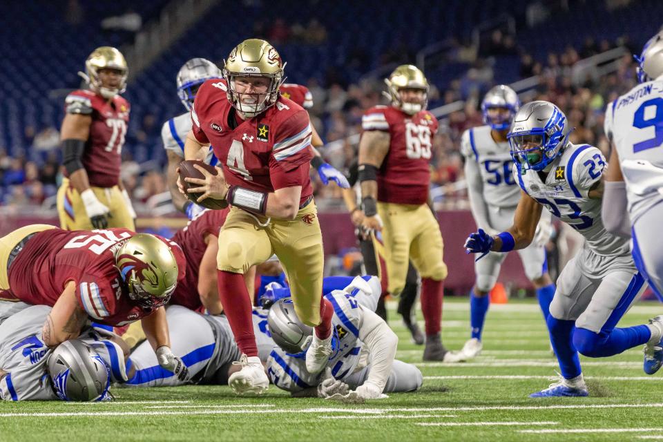 Michigan Panthers quarterback E.J. Perry runs for a touchdown against the St. Louis Battlehawks during the second half of UFL action at Ford Field, March 30, 2024.