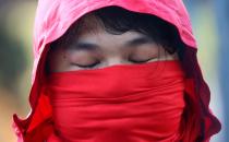 A protester reacts as he addresses the media at the Polytechnic University in Hong Kong