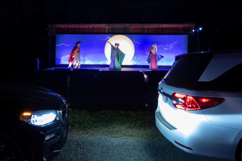 The Sanderson sisters from "Hocus Pocus" perform onstage outside at Freeform's Halloween Road experience in Los Angeles.