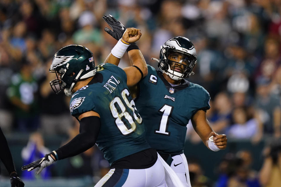Philadelphia Eagles quarterback Jalen Hurts (1) celebrates his touchdown with Philadelphia Eagles tight end Zach Ertz (86) during the second half of an NFL football game against the Tampa Bay Buccaneers on Thursday, Oct. 14, 2021, in Philadelphia. (AP Photo/Matt Rourke)