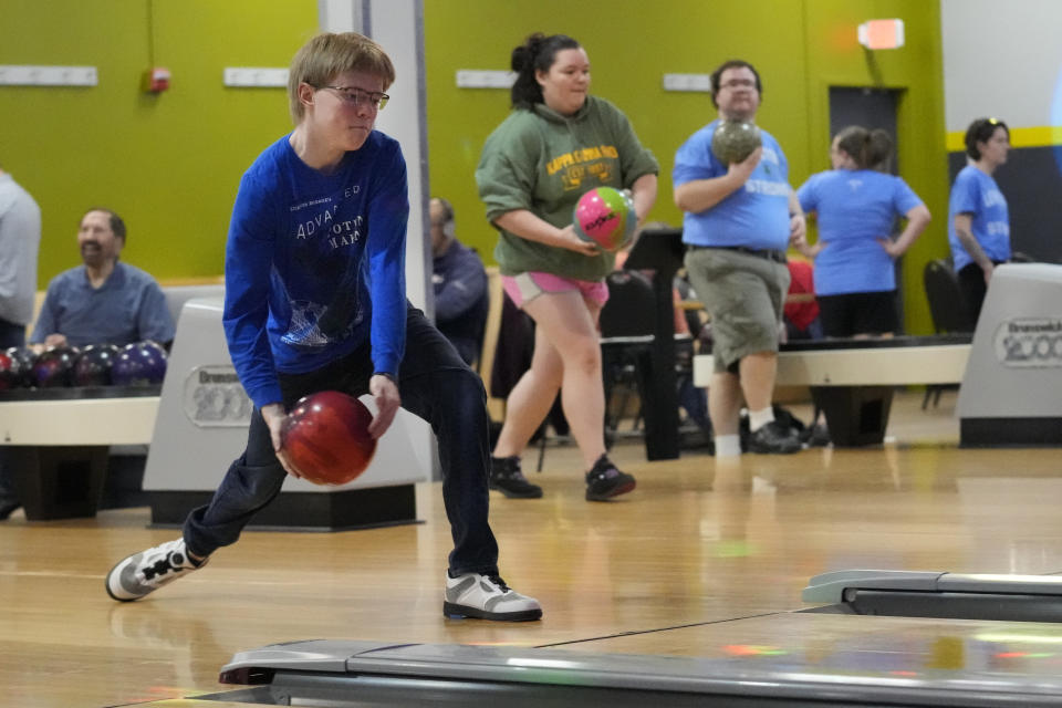 Colin Robinson bowls at Just In Time Recreation during the reopening of the bowling alley six months after a deadly mass shooting, Friday, May 3, 2024, in Lewiston, Maine. (AP Photo/Robert F. Bukaty)
